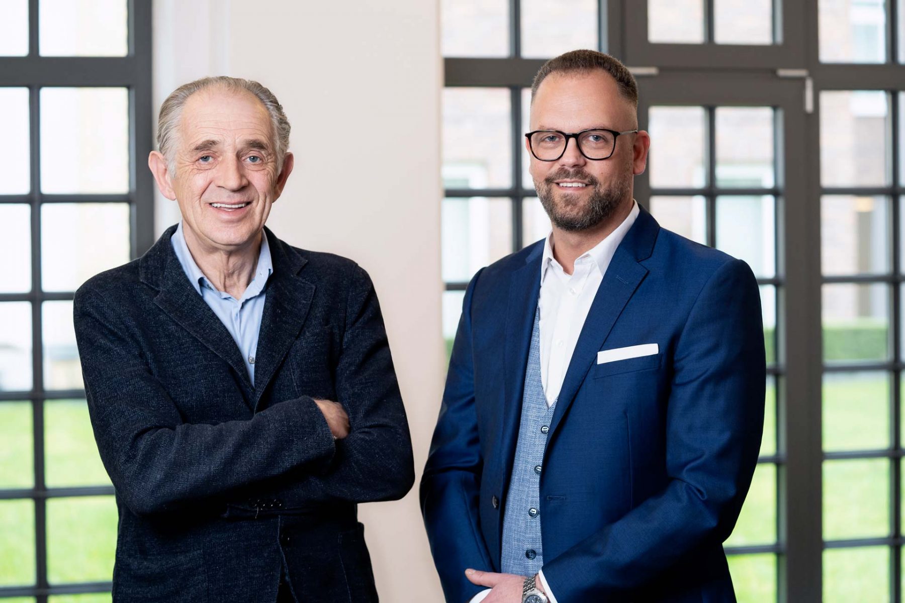 Porträt von AMR-Gründer Ulrich Buchholz und dem neuen Managing Director Herbert Höckel
